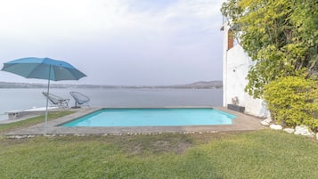 Outdoor pool, open 8:00 AM to 10:00 PM, pool umbrellas, pool loungers