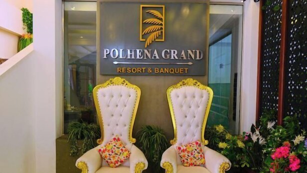 A reception area with two ornate chairs and a banner reading "Polhena Grand Resort & Banquet". - Polhena Grand Resort & Banquet (Matara)