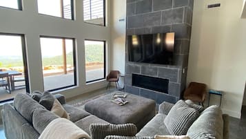 Smart TV, fireplace, table football, books