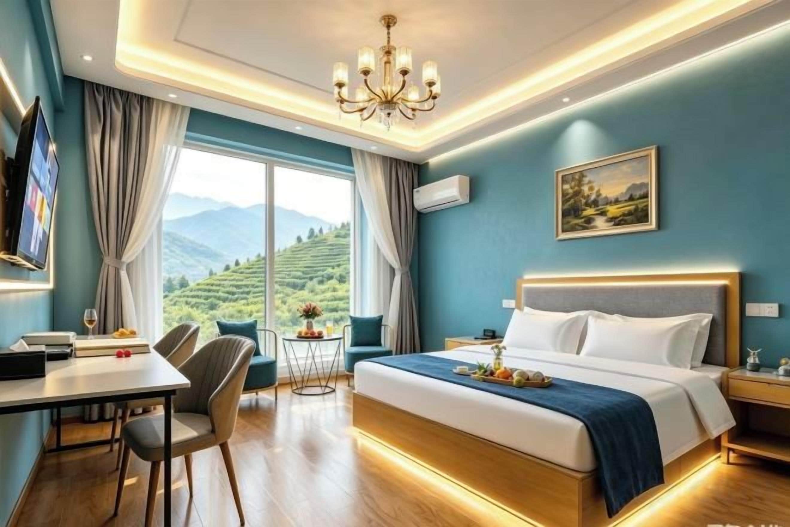 A hotel room with a bed, a desk, a chair, a TV, and a view of the mountains.
