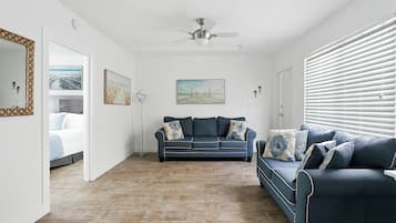 Deluxe Apartment, Partial Ocean View | Living area