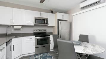 Classic Apartment, Partial Ocean View | Private kitchen | Full-size fridge, microwave, oven, stovetop
