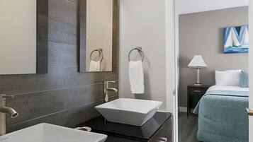 Classic Apartment, Partial Ocean View | Bathroom | Hair dryer, towels, soap, shampoo