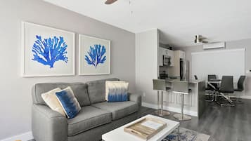 Classic Apartment, Partial Ocean View | Living area | Flat-screen TV