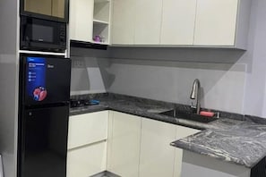 Private kitchen - Kadal Apartments: Cozy One-Bedroom Apartment (Abuja)