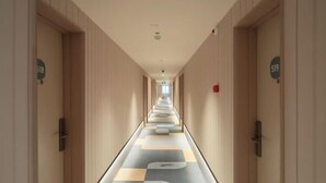 A hotel corridor with doors numbered 518 and 519, leading to rooms.