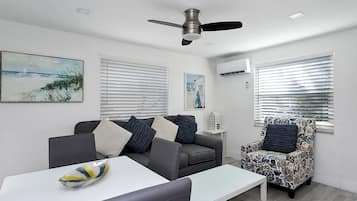 Classic Apartment, Partial Ocean View | Living area | Flat-screen TV
