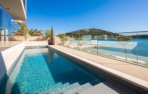 Relax by the pool with a clear view of the surrounding landscape.
