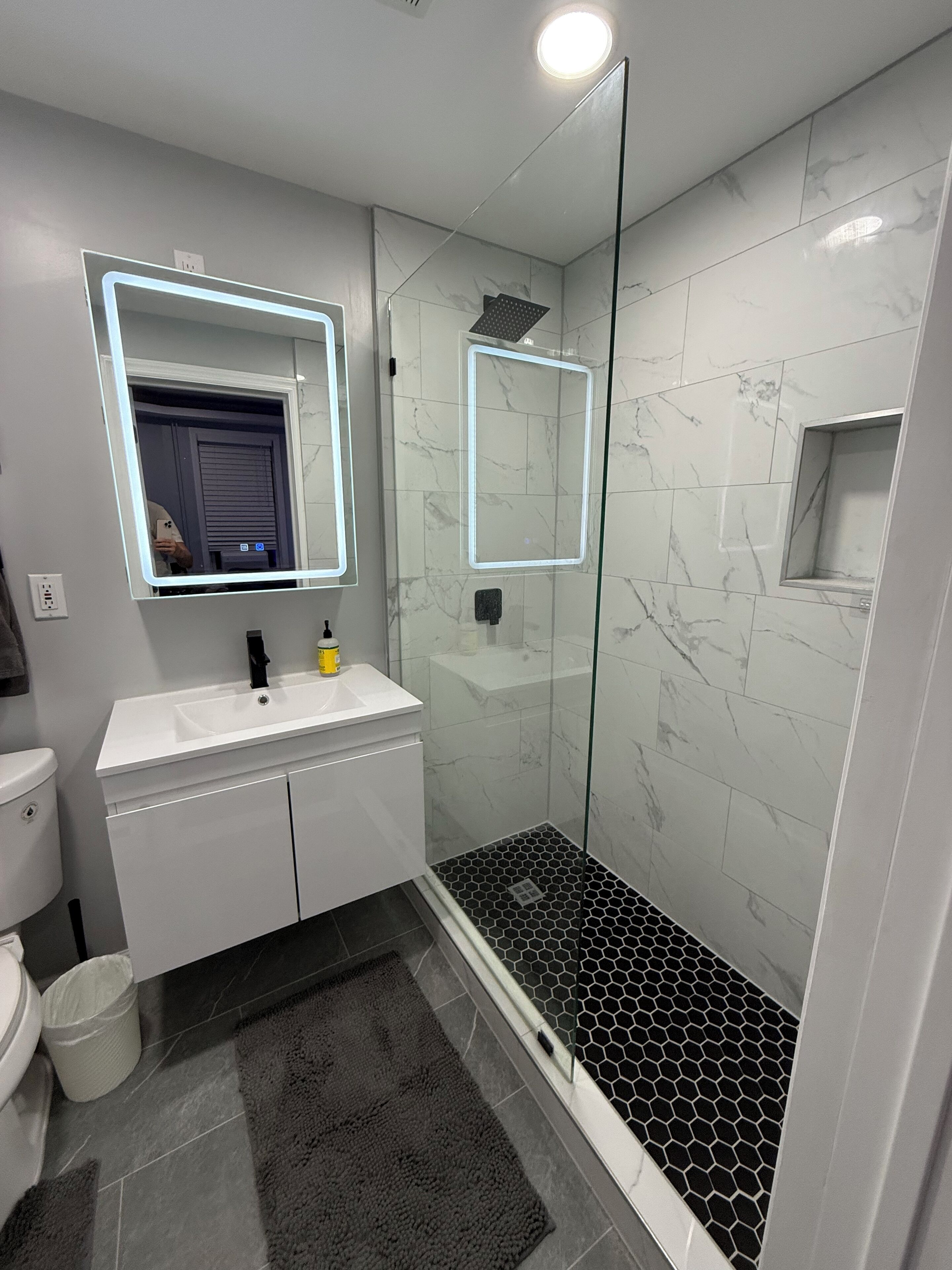 Shower, hair dryer, towels, shampoo