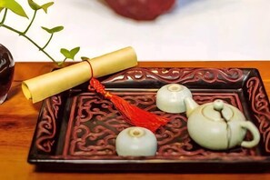 A traditional tea set on a decorative tray. - Yongyichang Inn (Pingyao County)