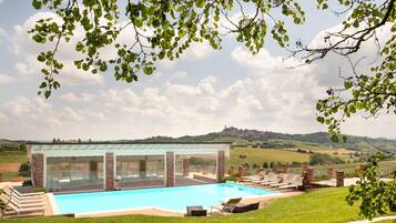 Seasonal outdoor pool, open 9:00 AM to 7:00 PM, pool umbrellas