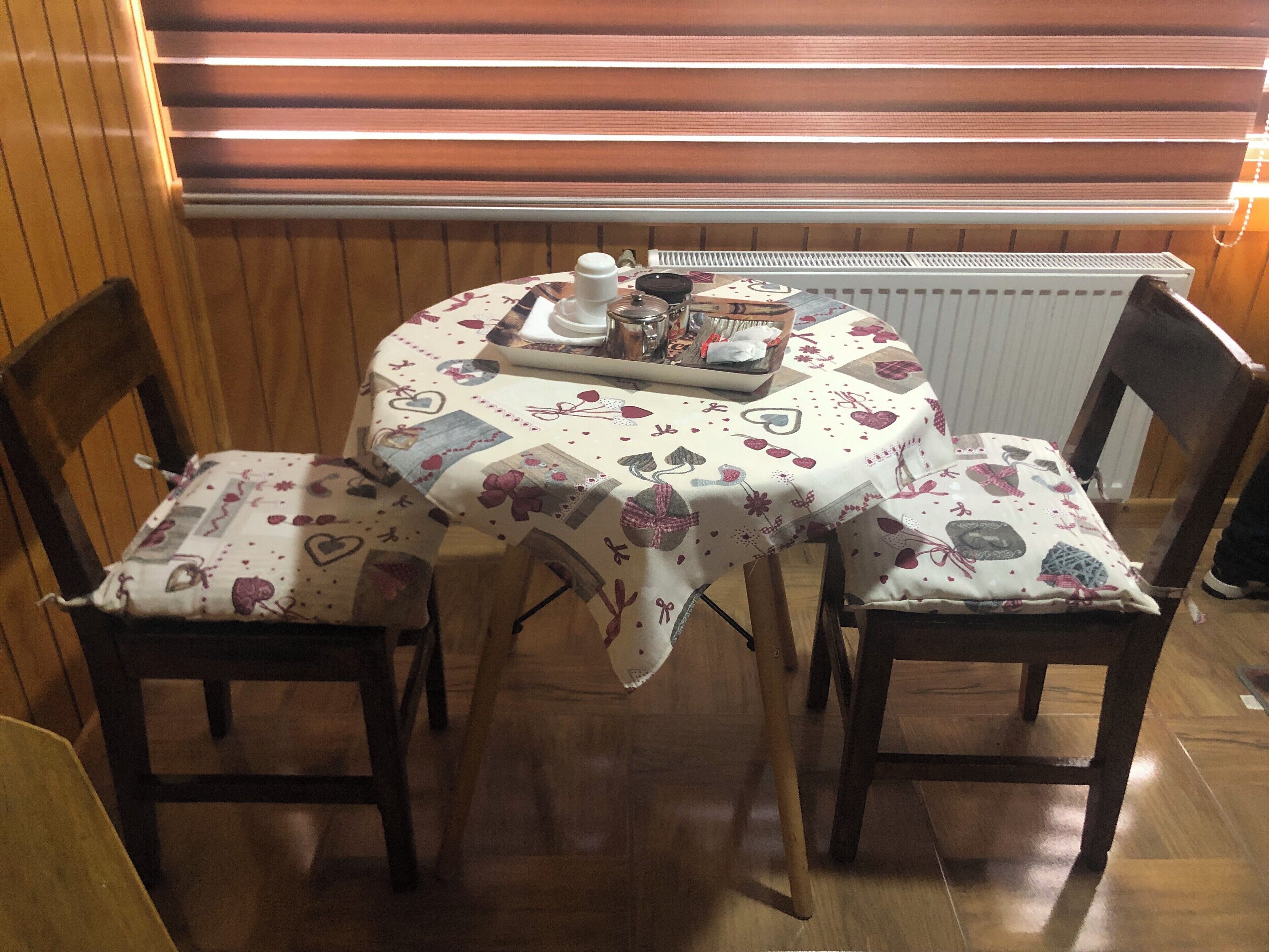 Mini-fridge, stovetop, cookware/dishes/utensils, dining tables