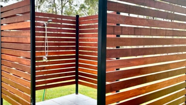 A wooden partition with horizontal slats and a metal frame. - Bushland Escape: A rural bush setting on acreage suitable for small groups (Moruya)