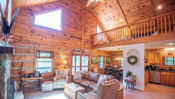 A spacious wooden cabin with a loft bedroom, a dining area, and a kitchen. - Bear Haven | Overlooks a Bass-Stocked Pond | Pool Table & Card Table (Grassy Creek)