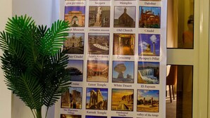 A promotional display for Pyramids Sunshine Inn featuring a variety of famous landmarks and attractions.