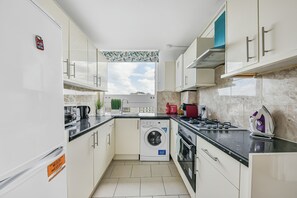 Comfort Apartment, City View | Private kitchen | Full-sized fridge, microwave, oven, stovetop
