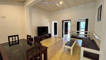 Luxury Bungalow | Living area | 65-inch Smart TV with digital channels
