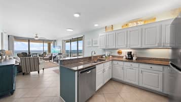 Signature Condo, 3 Bedrooms, Balcony, Beach View | Living room | 50-inch Smart TV with cable channels