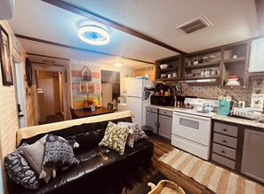 Living area - Charming 2-bedroom cabin with WiFi, AC in tranquil surrounding. (San Leon)