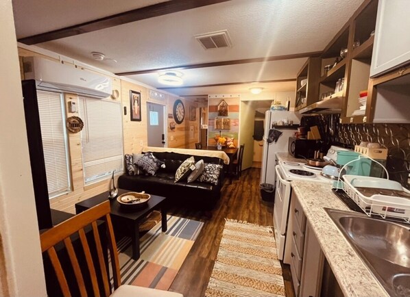 Interior - Charming 2-bedroom cabin with WiFi, AC in tranquil surrounding. (San Leon)