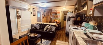 Charming 2-bedroom cabin with WiFi, AC in tranquil surrounding.