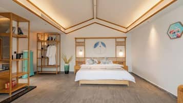 A modern bedroom with a wooden bed, built-in shelving, and a decorative wall piece.