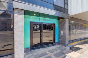 A modern building with a green awning and the number 20 on the entrance. - Sommet de la basse-ville / Downtown (Ville de Québec)