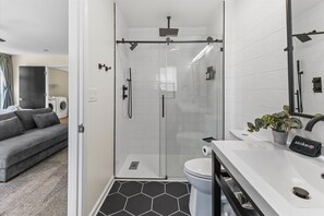 Shower, hair dryer, towels, shampoo - 100 Percent Remodel in the heart of DT (Indianapolis)