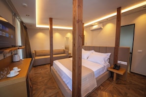 Deluxe Suite, Balcony, Sea View | 1 bedroom, minibar, in-room safe, desk