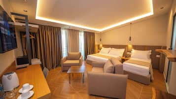 Triple Room, Balcony | Minibar, in-room safe, desk, blackout drapes