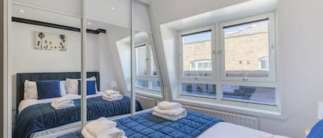 1 bedroom, desk, bed sheets
