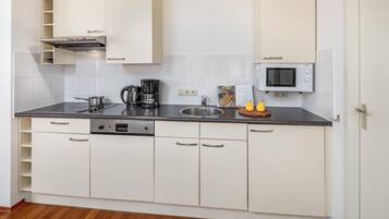 Fridge, stovetop, coffee/tea maker, electric kettle