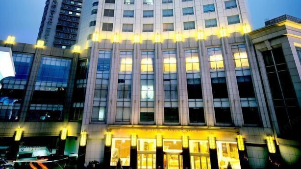 A high-rise hotel with a prominent entrance and multiple floors. - Huatian Hotel(Wuhan Xudong Metro Station) (Wuhan)