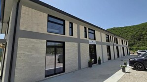 A modern building with a flat roof, large windows, and a sign reading "Liminka".
