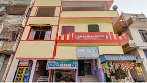 A multi-story building with a sign reading "Hotel Bhaskar." - Bhaskar Hotel By GRB (Ghaziabad)