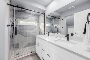 Shower, hair dryer, towels, shampoo
