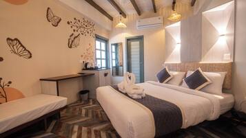 Desk, iron/ironing board, bed sheets