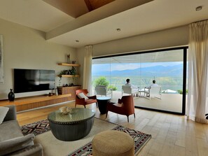 Presidential Villa | Living area | 32-inch TV with satellite channels