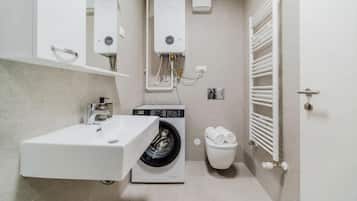 Combined shower/tub, hair dryer, towels, soap