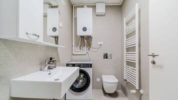 Family Apartment, Multiple Bedrooms (Modern Apartment With Balcony And) | Bathroom | Combined shower/tub, hair dryer, towels, soap