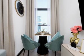 Classic Studio, Balcony, City View | Dining room - Waves - Sophisticated Studio Living in Business Bay, Dubai  (Dubai)