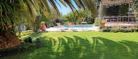 Outdoor pool, open 7:00 AM to 8:30 PM, pool loungers