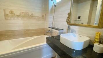 Designer toiletries, hair dryer, slippers, bidet