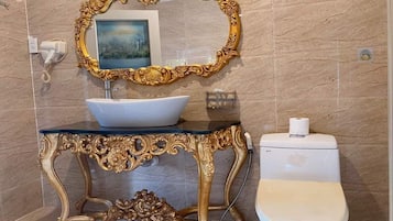 Deluxe Quadruple Room | Bathroom | Designer toiletries, hair dryer, slippers, bidet