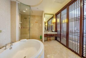 A modern bathroom with a large bathtub, a glass shower enclosure, and a wooden partition with a grid design. - Luling Hotel (Ji'an County)