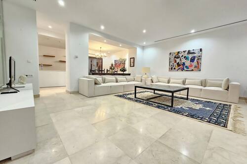 Elite Villa | Living area | 65-inch flat-screen TV with satellite channels, computer monitors
