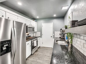 House | Private kitchen | Fridge, microwave, oven, stovetop - Veteran-Owned Home in Quiet OKC (Oklahoma City)