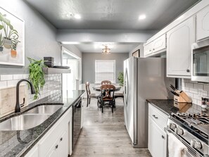 House | Private kitchen | Fridge, microwave, oven, stovetop - Veteran-Owned Home in Quiet OKC (Oklahoma City)