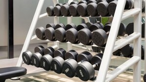 A rack of dumbbells in a gym setting. - Guomao Boutique Hotel (Zhangjiagang)