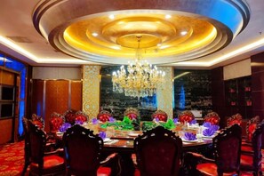 A formal dining room with a round table, ornate chairs, and a chandelier. - Building a Grand Hotel (Jingtai)